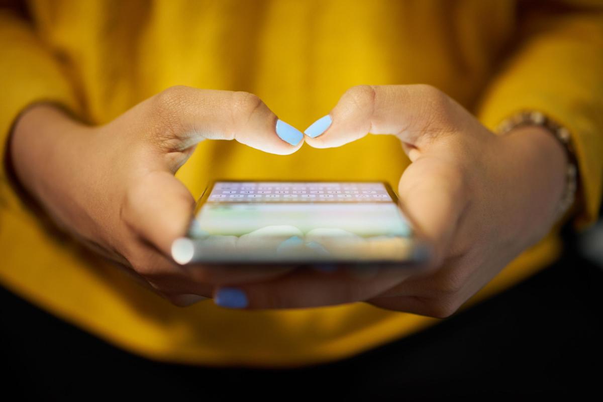 Show woman's hands using smart phone