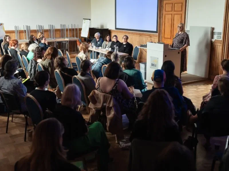 Shows audience and speakers at the main panel event at Climate Interchange and the Arts