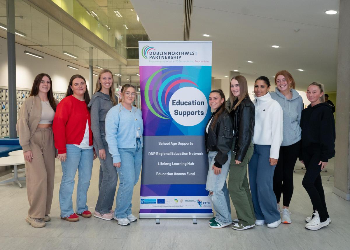 Shows Alex Grogan and fellow student teachers at launch event