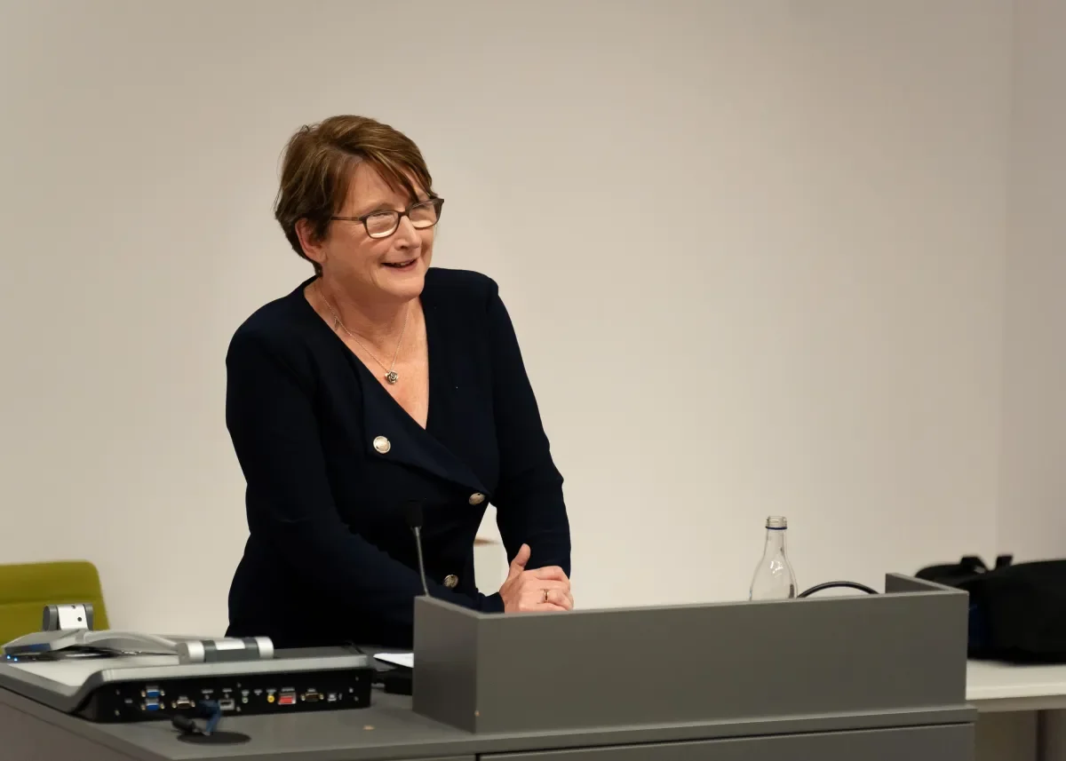 Shows Justice Siobhan Phelan launching report at event