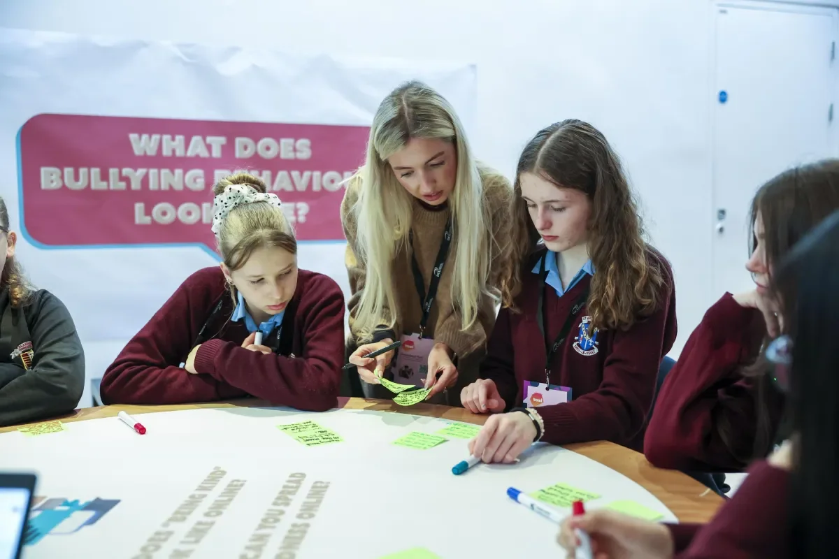 Shows ABC staff member engaging with students