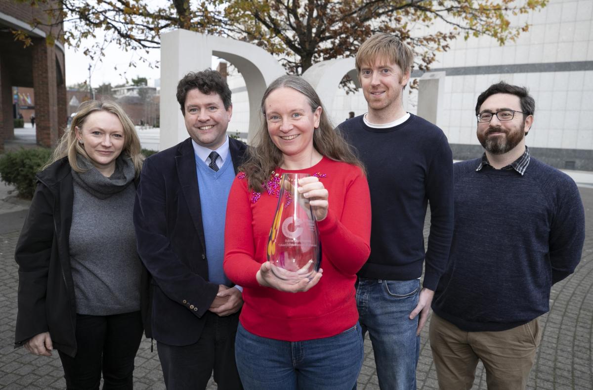 Shows staff members from DCU School of Mathematics with their Athena Swan Bronze Award