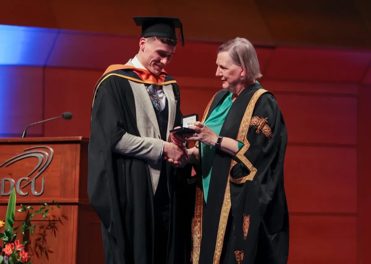 Shows Jordan Morrissey receiving his Chancellor's Medal from DCU Chancellor Brid Horan