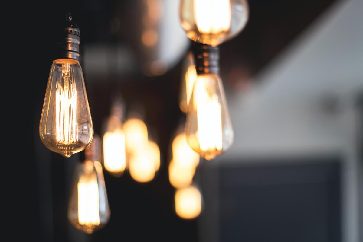 a bunch of lit lightbulbs