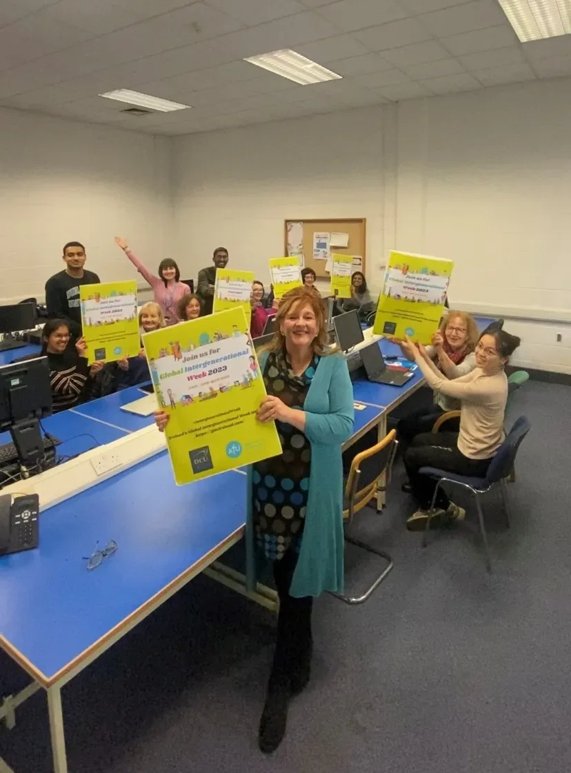 Age-Friendly University students and participants holding posters for GIW 2023