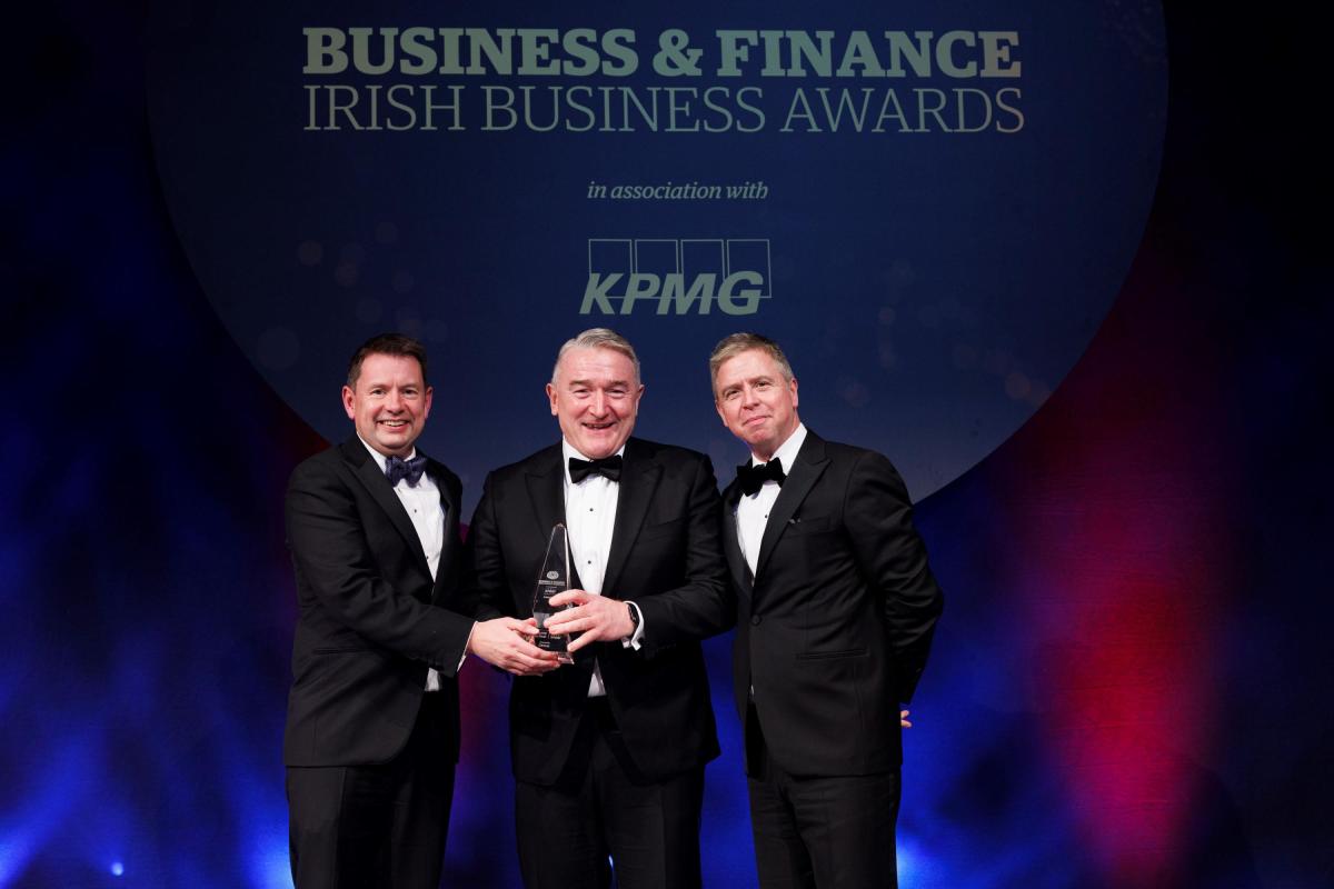Seamus Hand, Managing Partner, KPMG Ireland, presents Ornua CEO John Jordan with the 2022 Company of the Year Award, alongside Business & Finance President Ian Hyland.