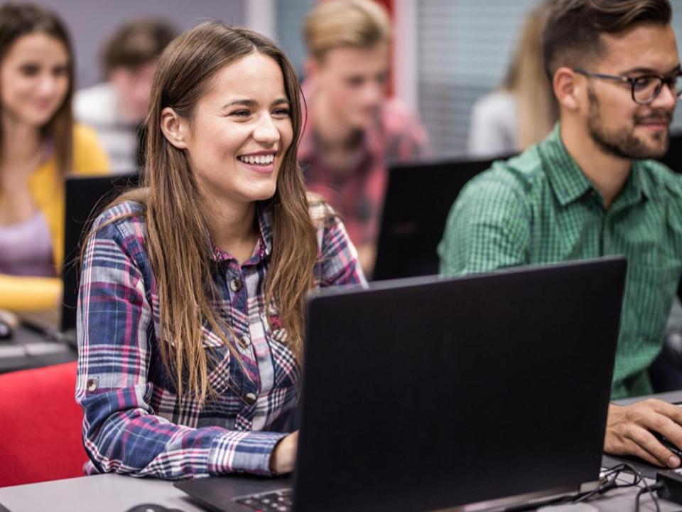 Students in a classroom using laptops