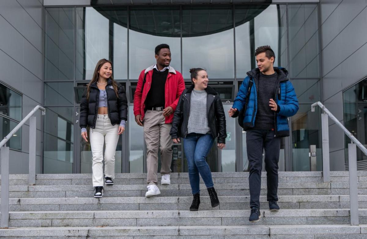 Students walking down steps and talking