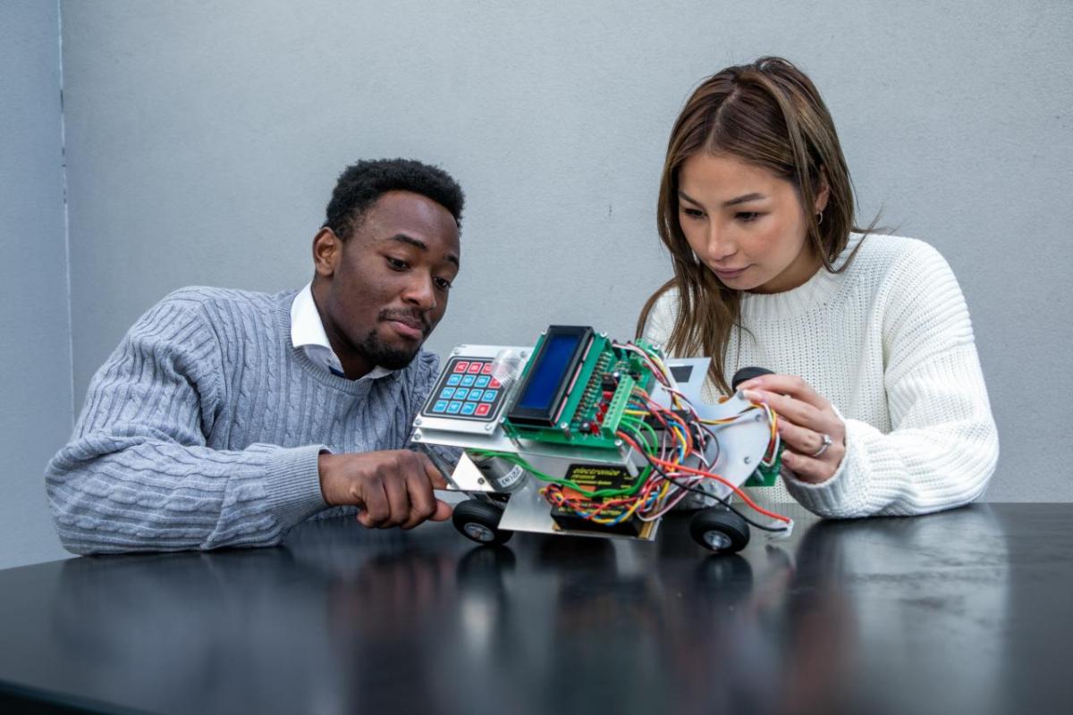 Two students collaborating on a prototype