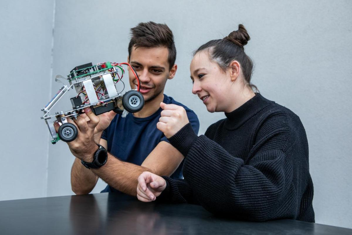 Two students collaborating on a prototype