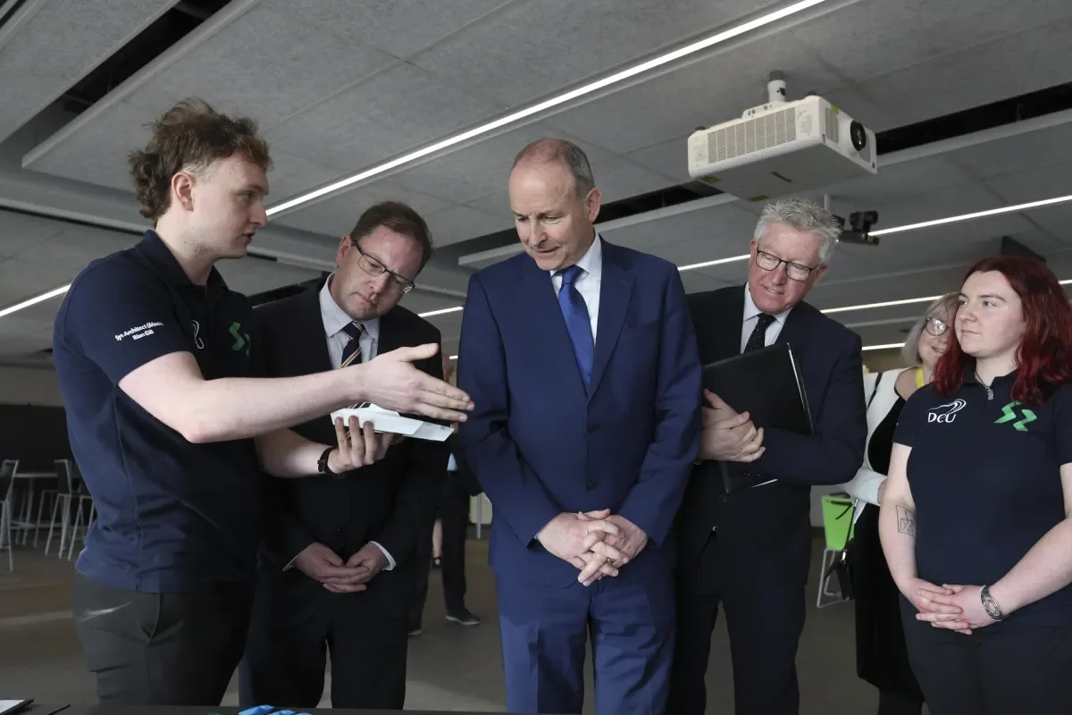 DCU students present their Solar Car project to An Taoiseach Micheál Martin TD and Minister for Further and Higher Education James Lawless TD.