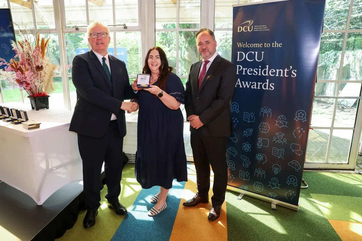 Mary Behan receiving her Award from Daire Keogh and Gareth Yore