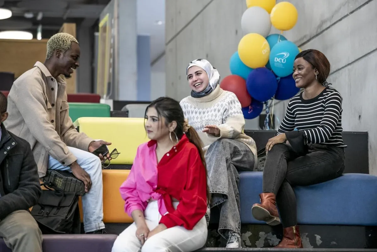 Students sitting on The Steps in the U Building
