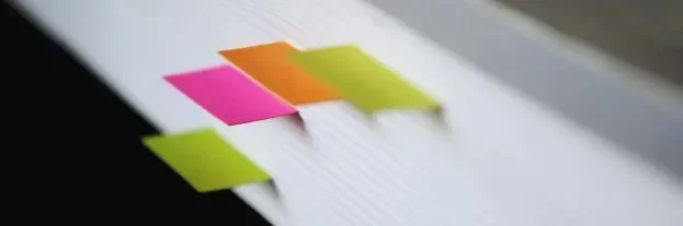 The edge of a book with page markers