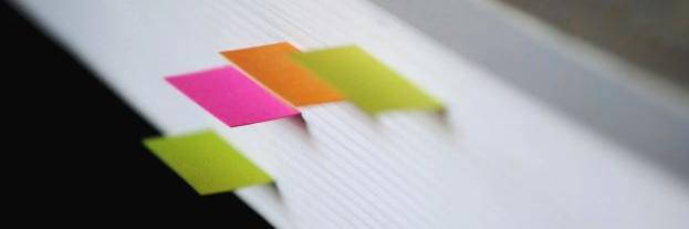 The edge of a book with page markers