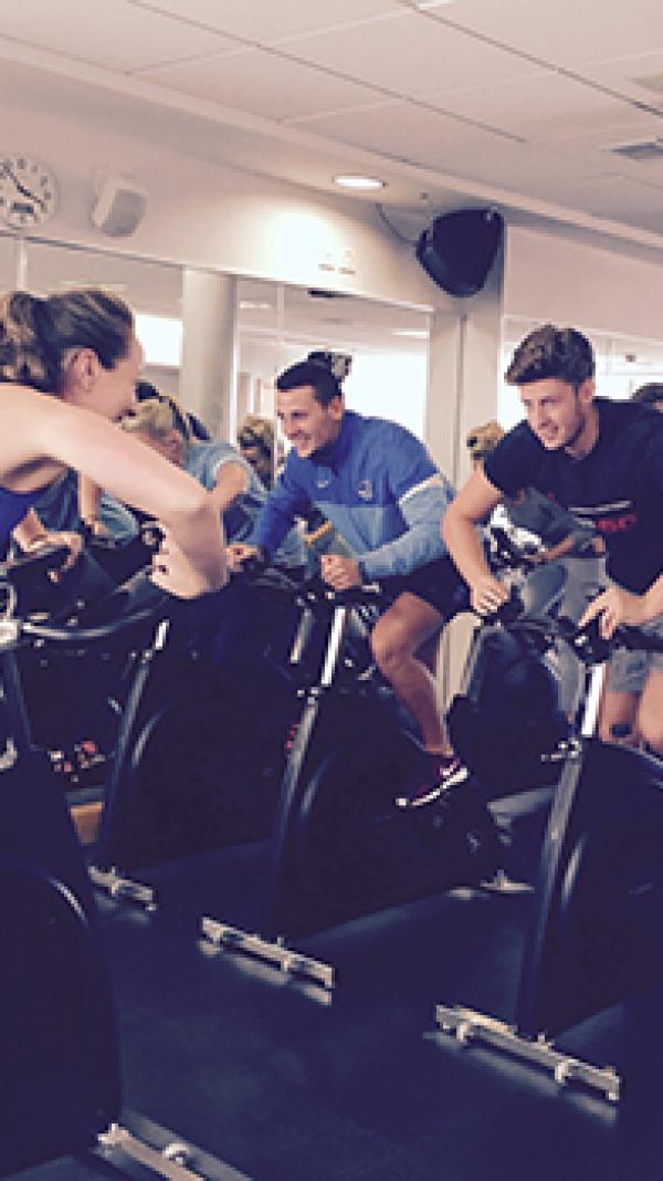 students on exercise bikes