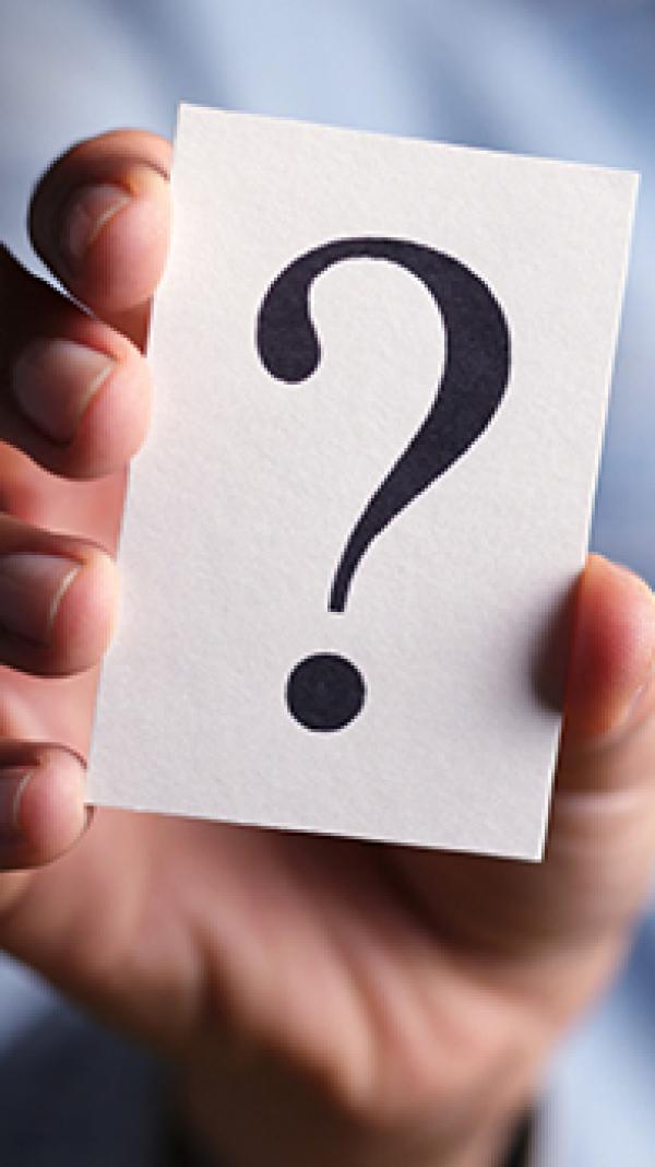 Holding a question mark card