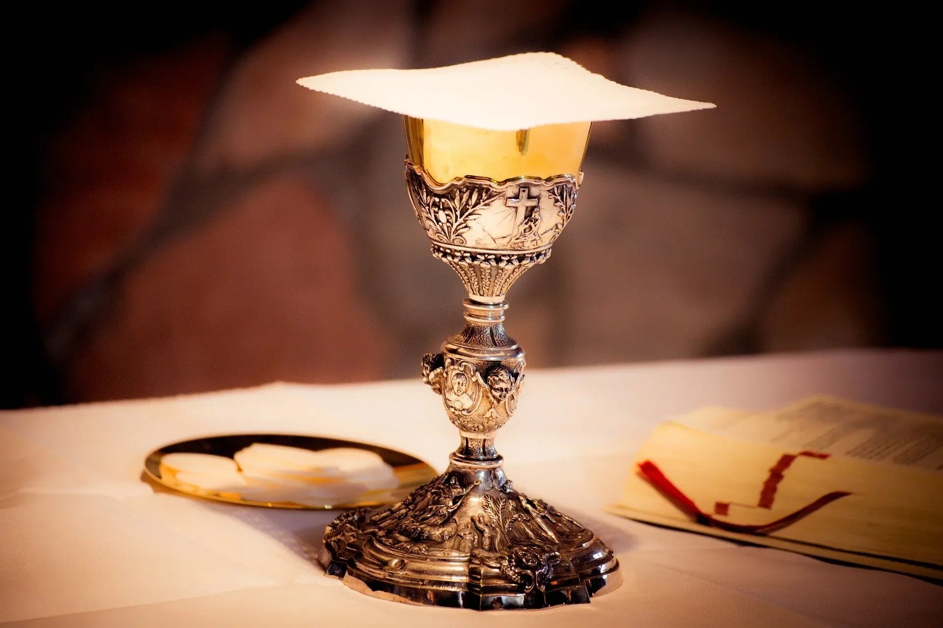 Chalice and Host in Roman Catholic Mass service