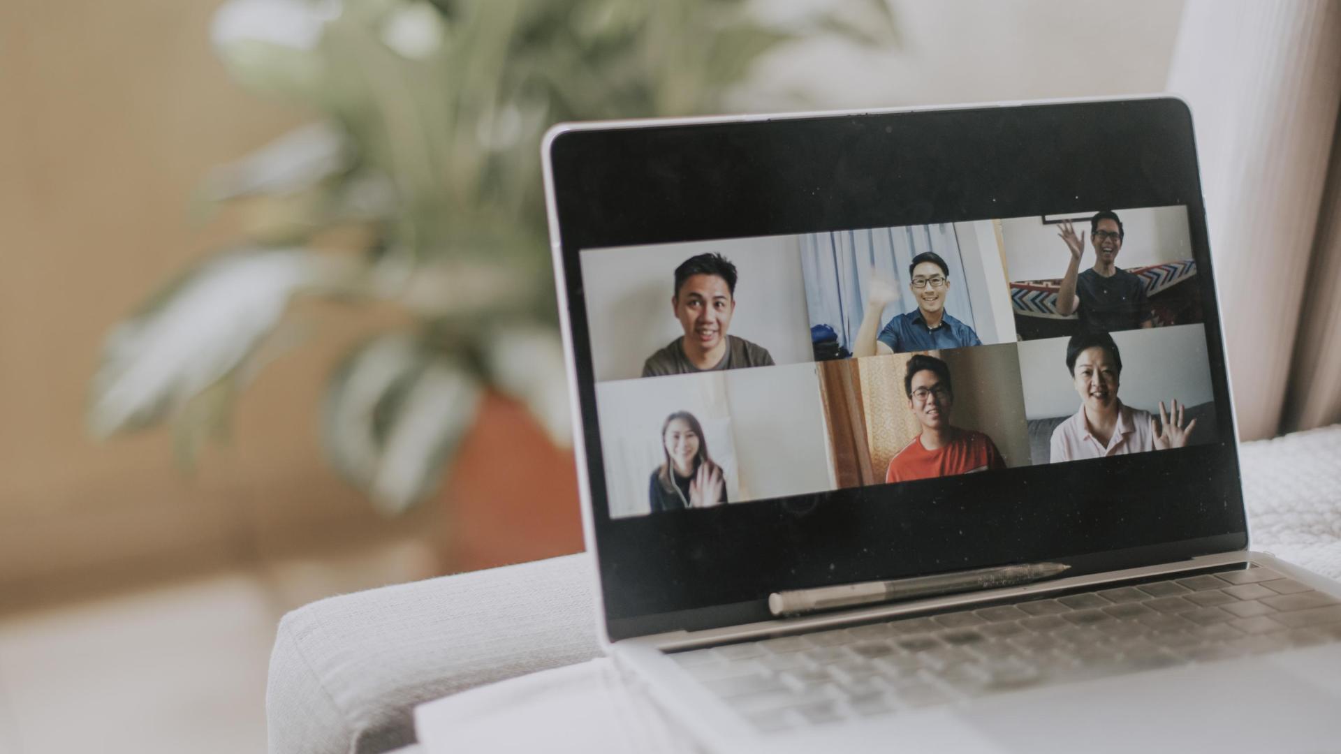 Photo of a laptop screen showing several students on a video chat session