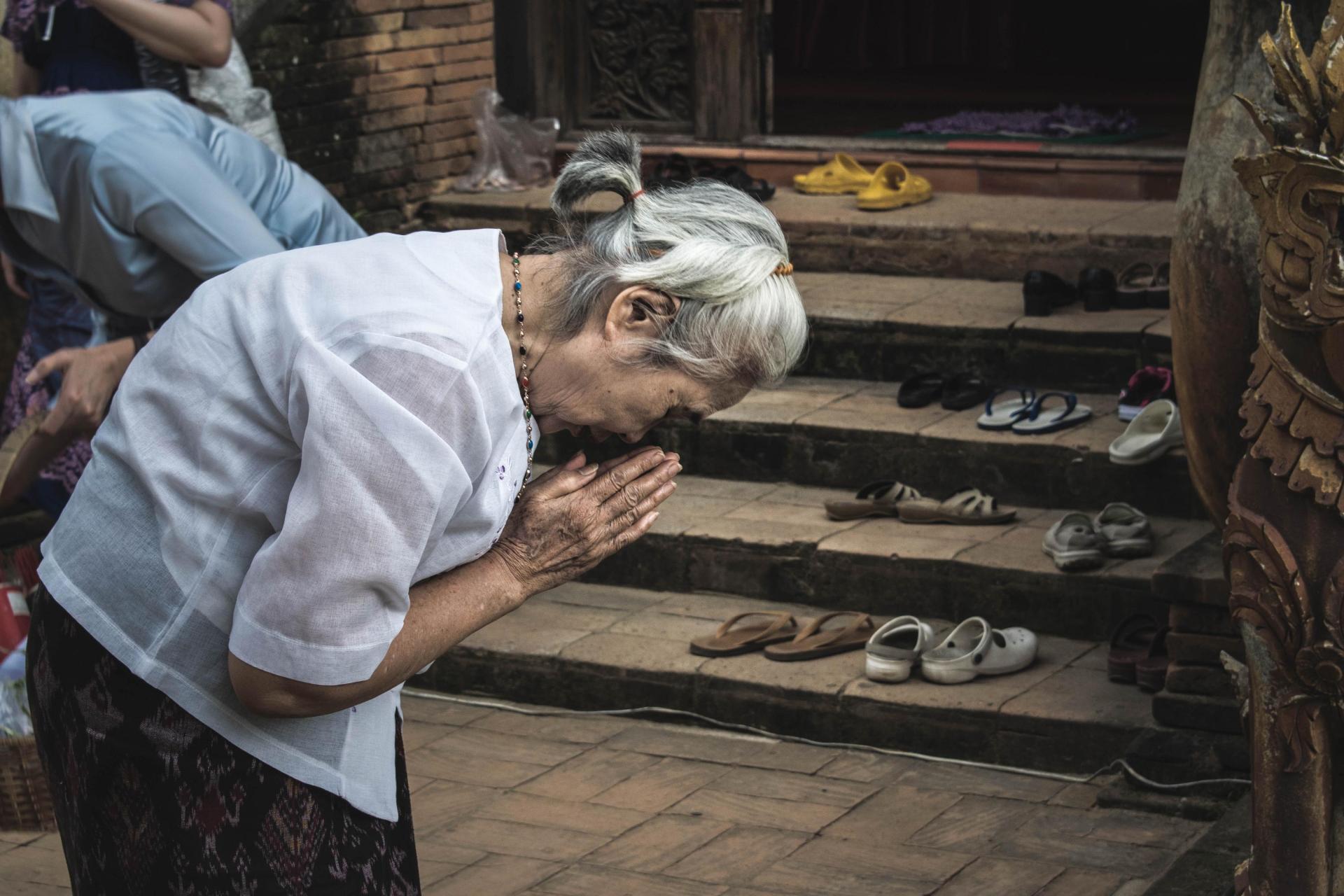Prayer outside Thai temple
