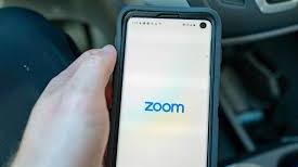 Mobile phone showing Zoom logo