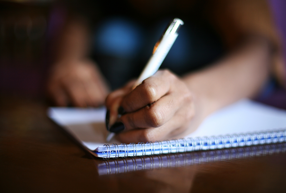 hand writing on notebook