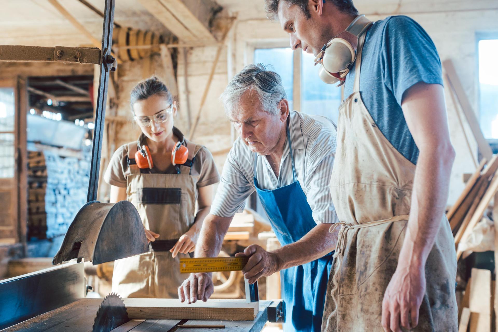 Grandfather teaches the family craft to two grandchildren