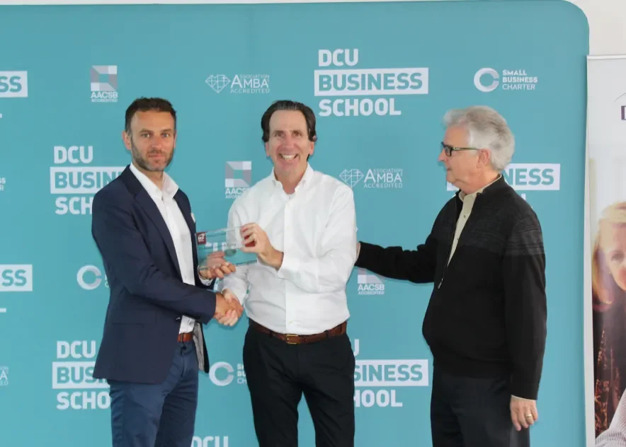 Director Eric Clinton presents Dr Justin Craig with a plaque of honour following fellowship in DCU