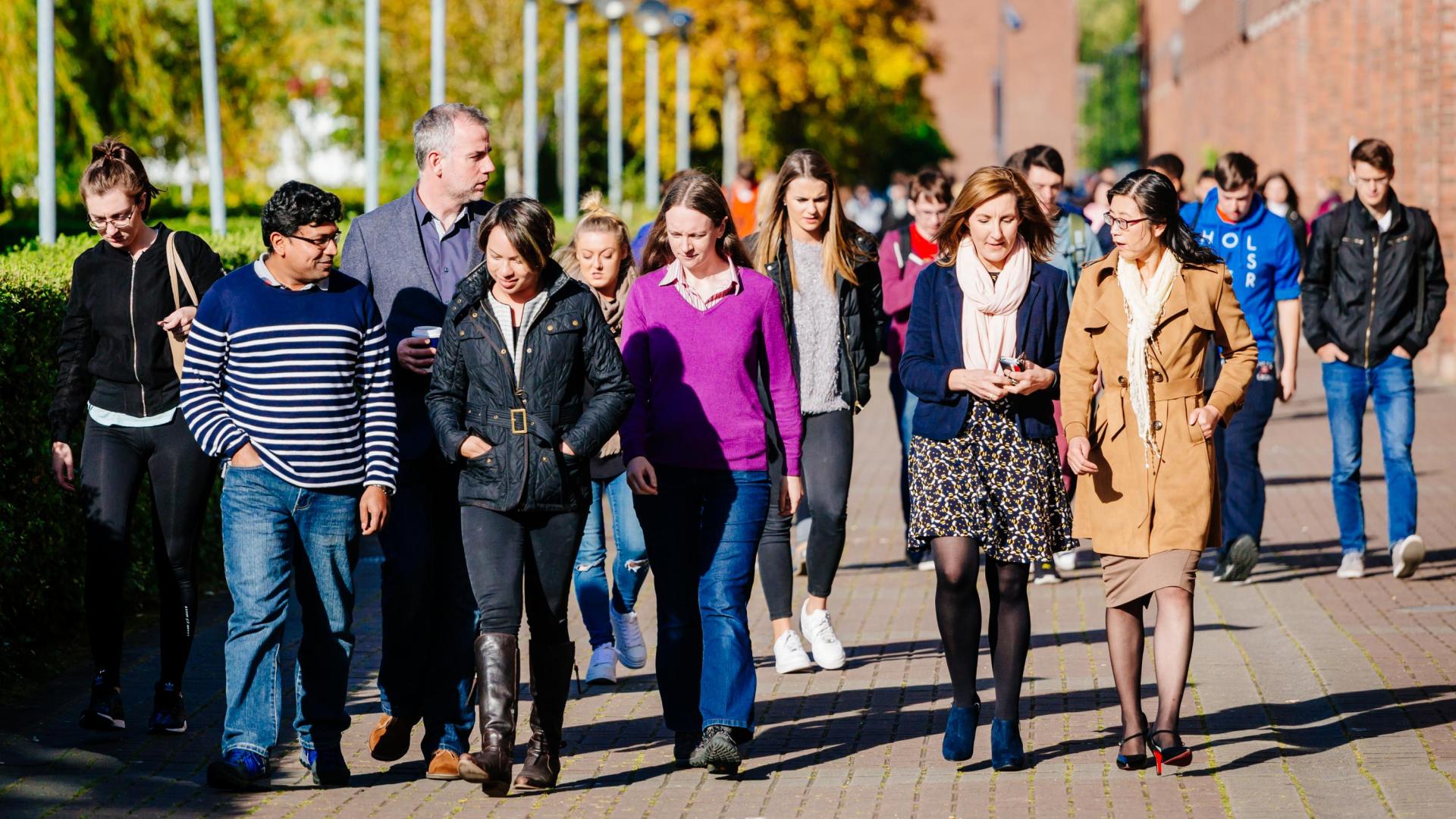 Staff walking through campus