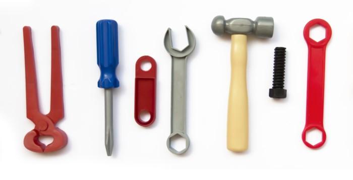 Row of tools including hammer and screwdriver