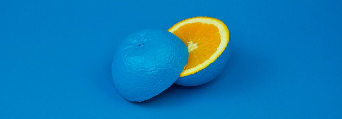 Orange painted blue on outside and showing orange inside
