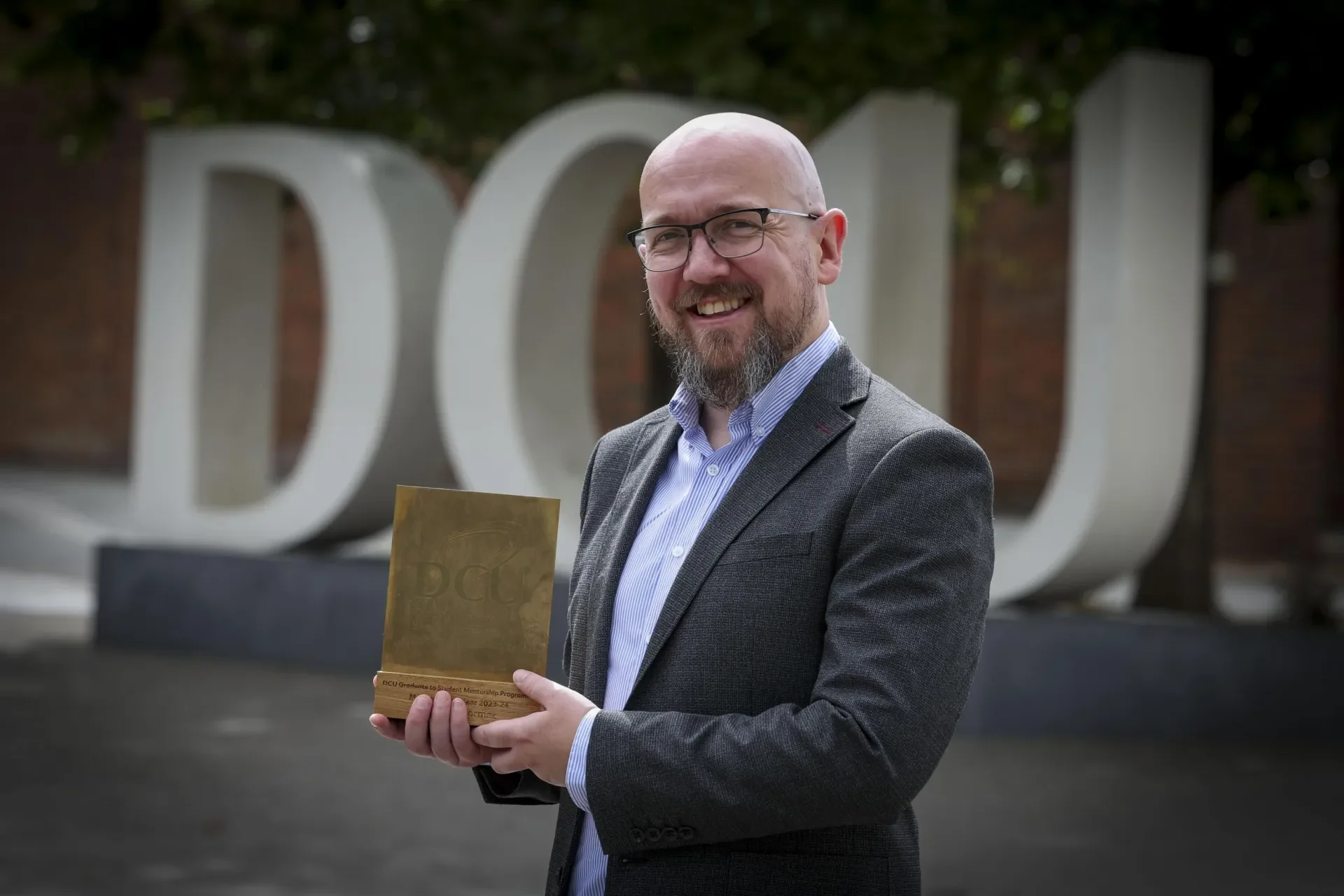 Jason McCromac accepts his award