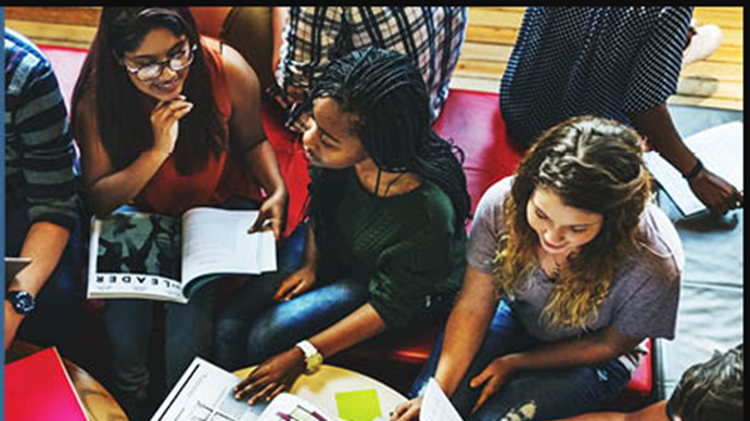 A group of people sitting around a table