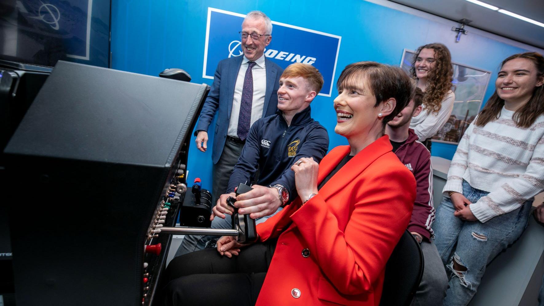 Minister Norma Foley with students and Sir Martin Donnelly, president of Boeing Europe and managing director of Boeing in the UK and Ireland.