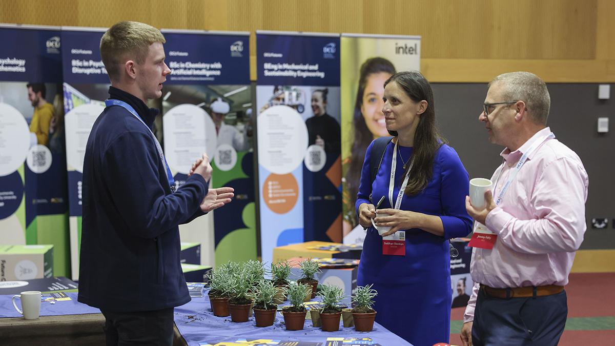 Stephen Murnane (1st year Global Challenges student) interacting with attendees at the DCU stand.