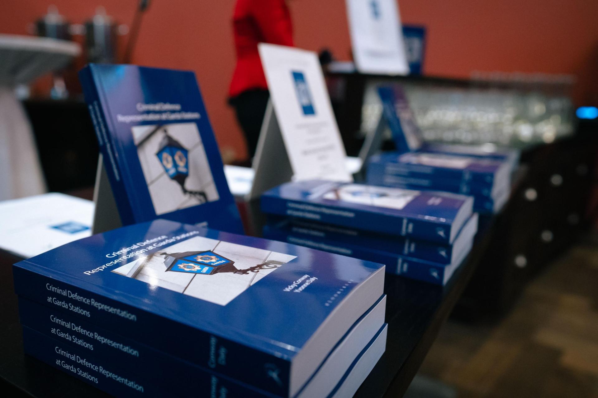 Copies of the book Criminal Defence Representation at Garda Stations laid out on a table at the book's launch