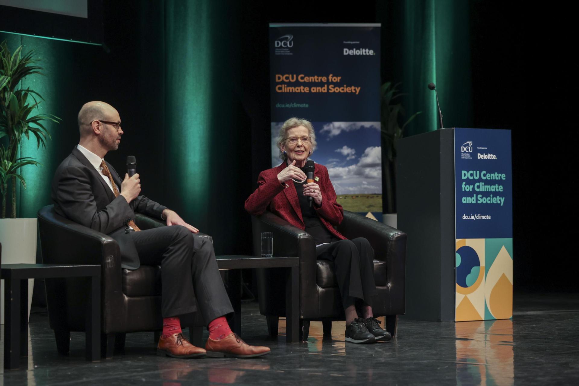 Mary Robinson addressing the Climate Change conference, seated beside Dr Diarmuid Torney
