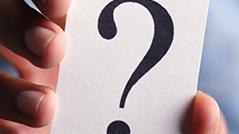 Holding a question mark card