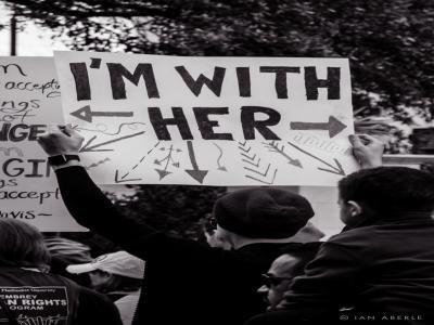 Person holding sign at march "I'm with her"