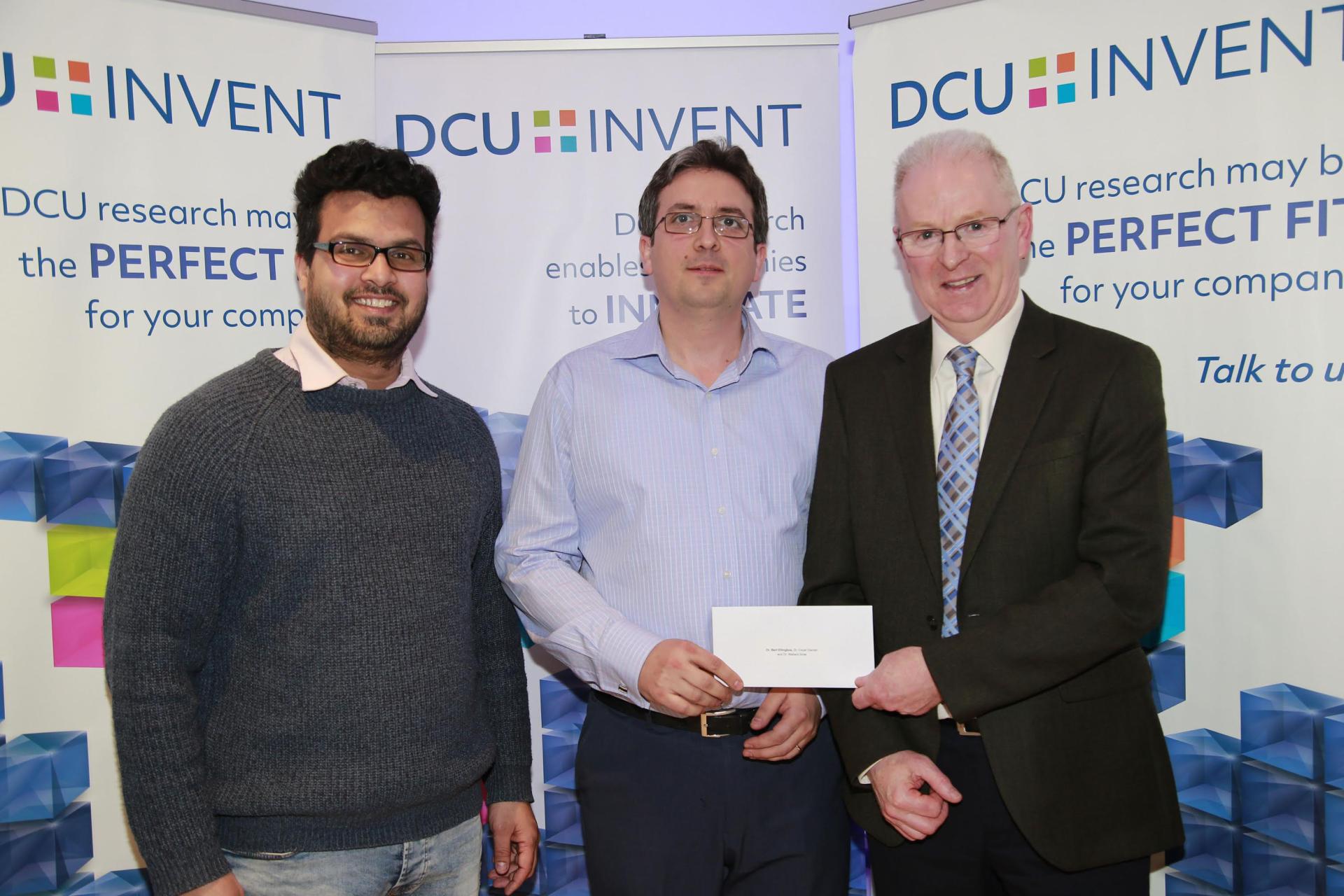 Dr. Nishant Sirse, Dr. Cezar Gaman and Prof. Greg Hughes receiving their award