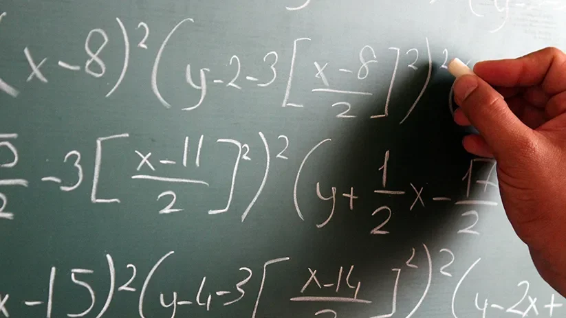 Mathematics equation on a chalk board