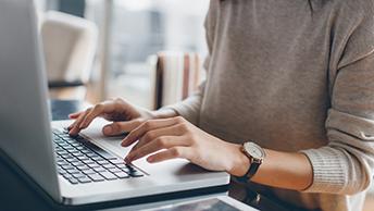 Stock image of person at computer