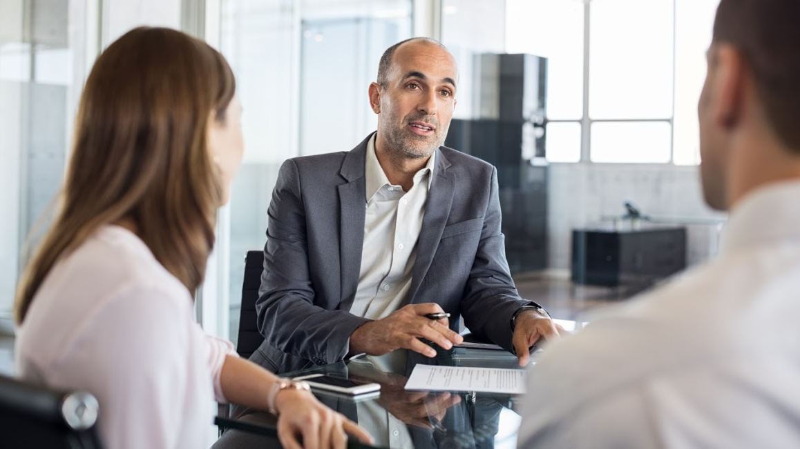 3 people in business meeting