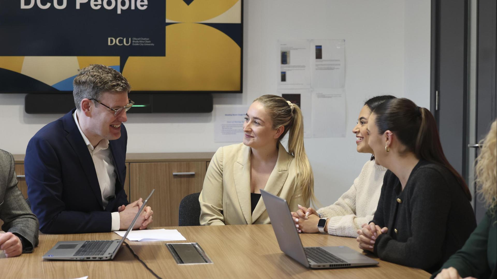 4 people sitting and chatting