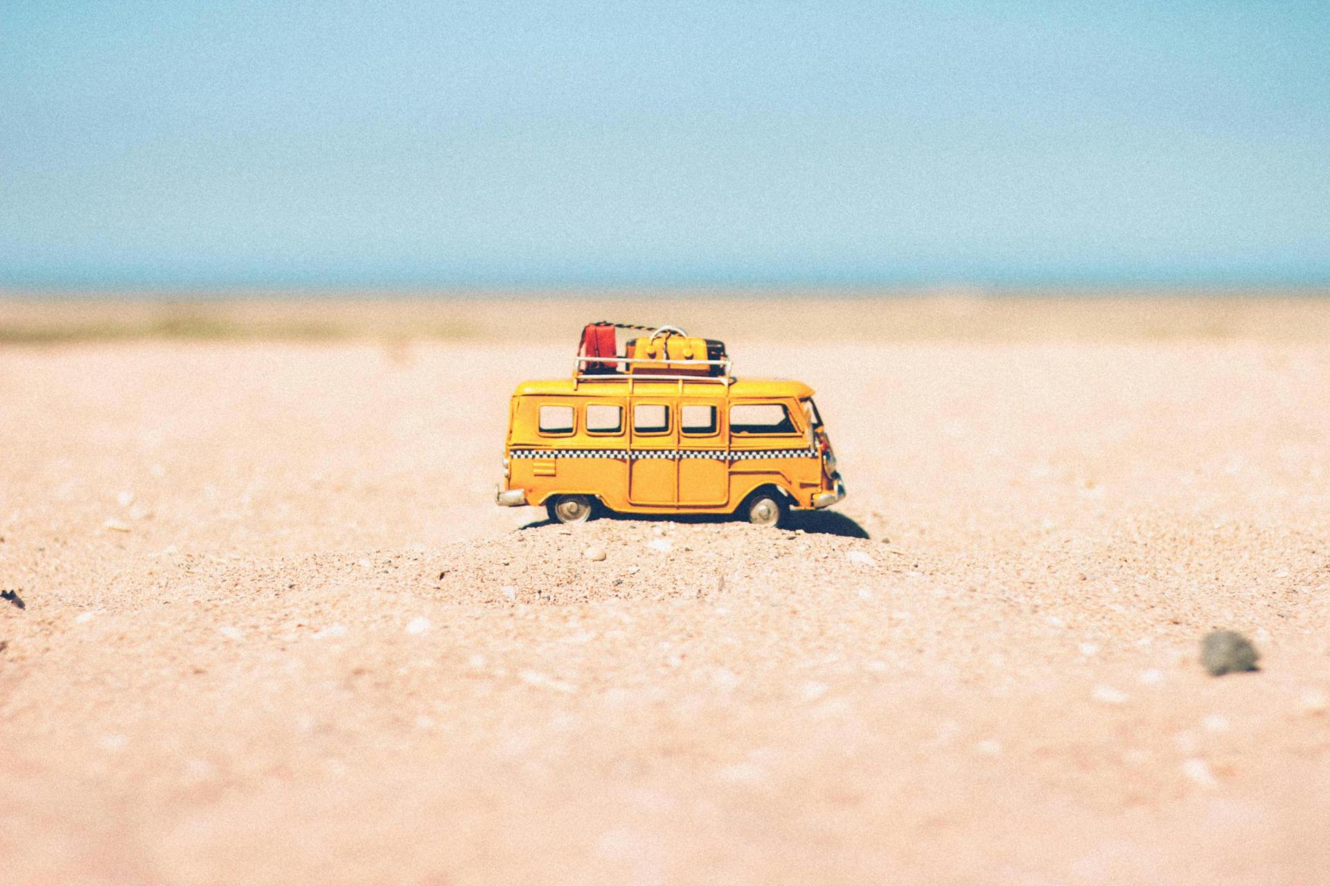 Toy camper van on beach