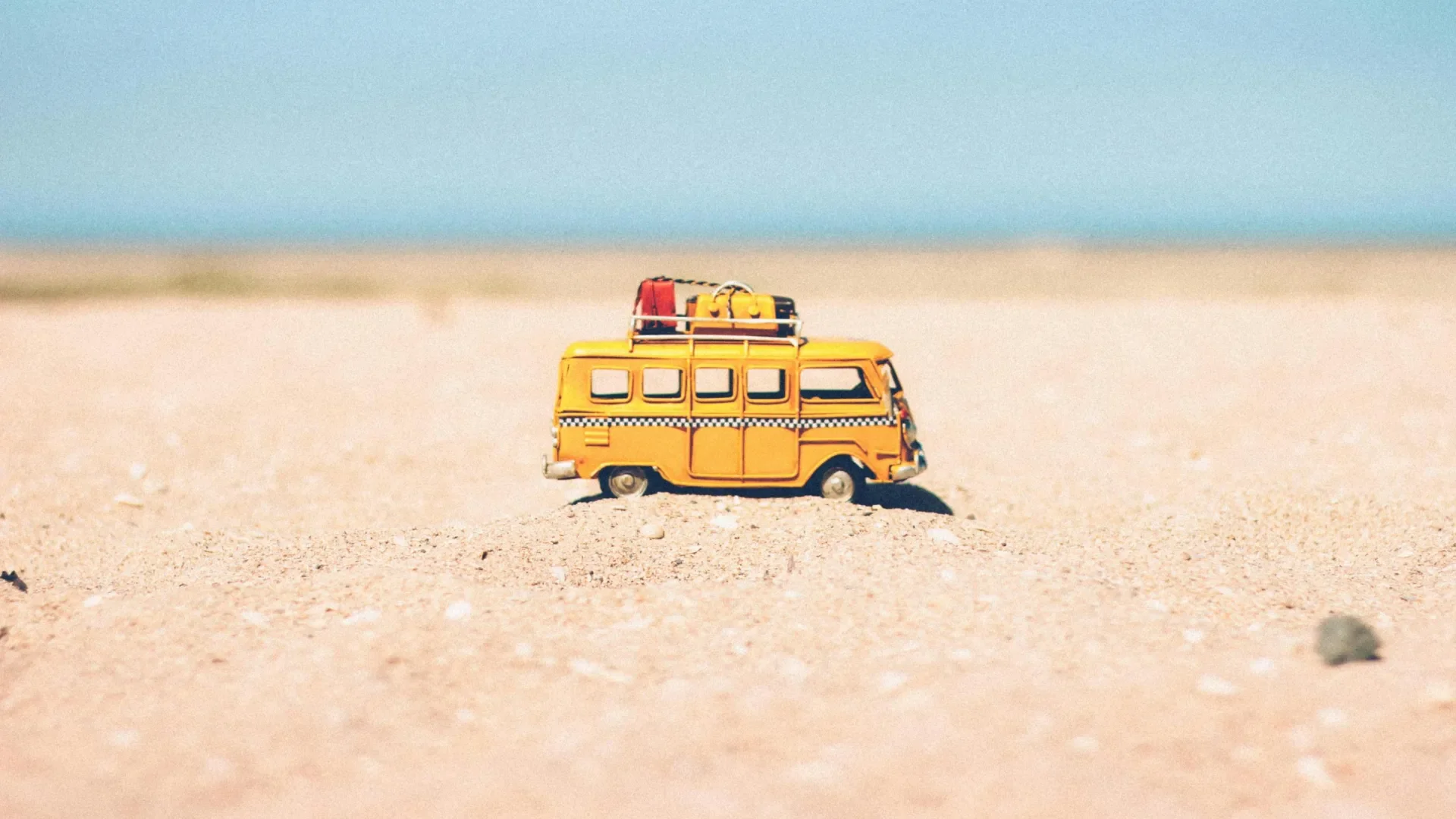 Toy camper van on beach