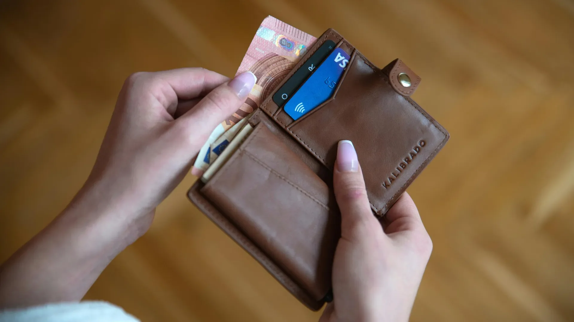 Wallet with cash and cards in it. 