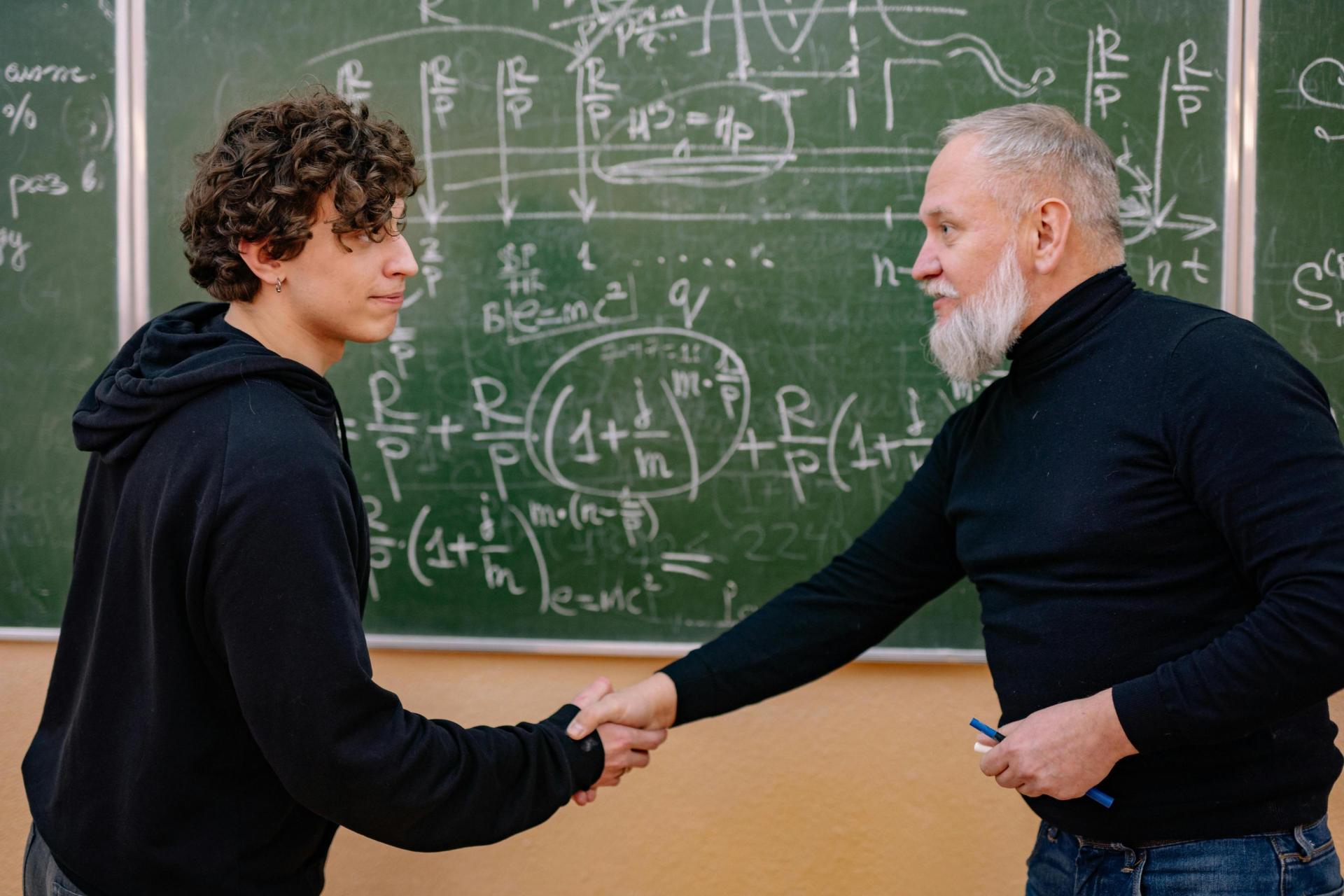 Student and Professor shaking hands