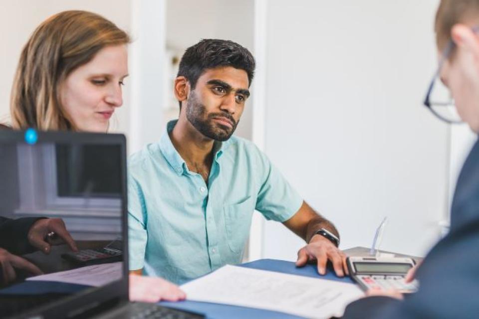 three people in a meeting