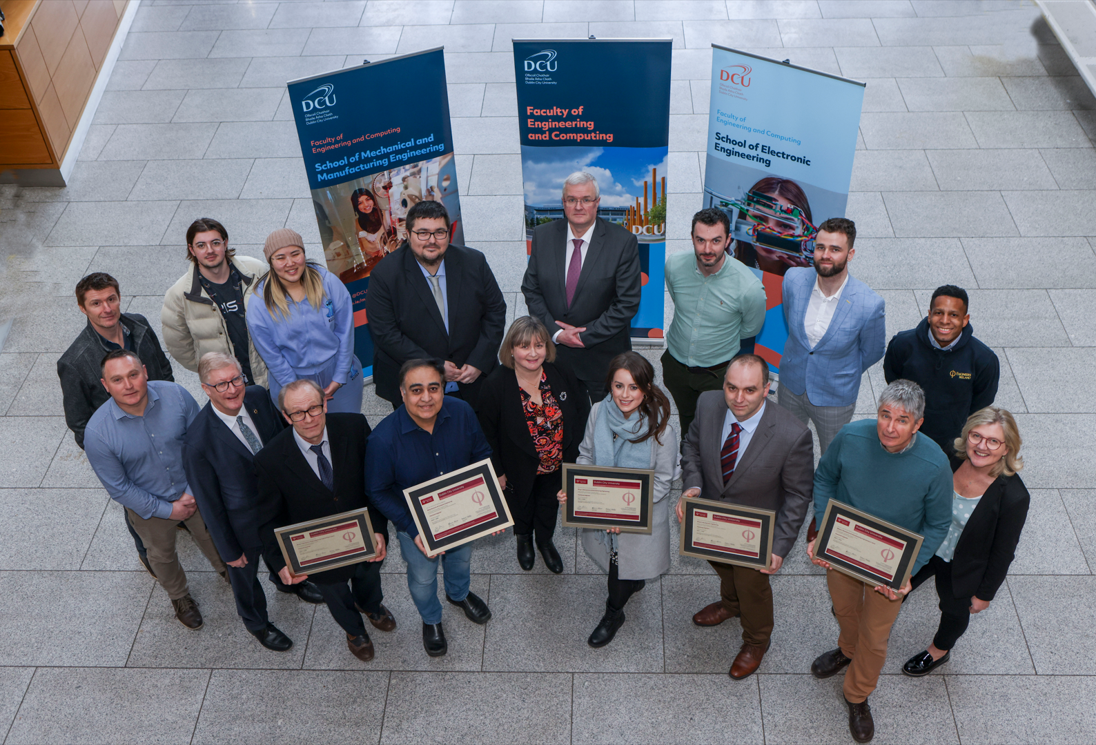 Shows Engineers Ireland and DCU Course Chairs with Accreditation posters